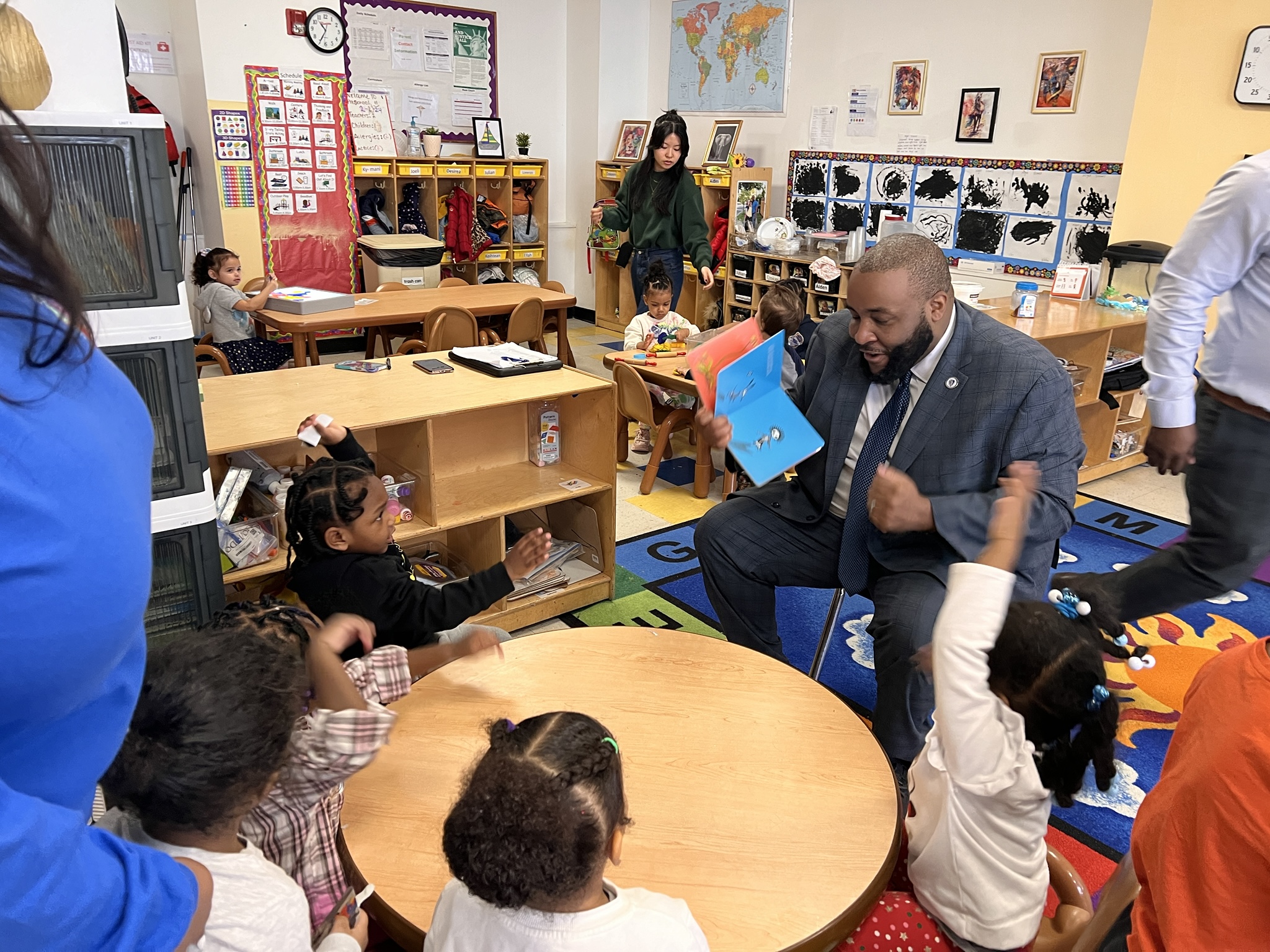 Chris Worrell reading to children in Dorchester classroom